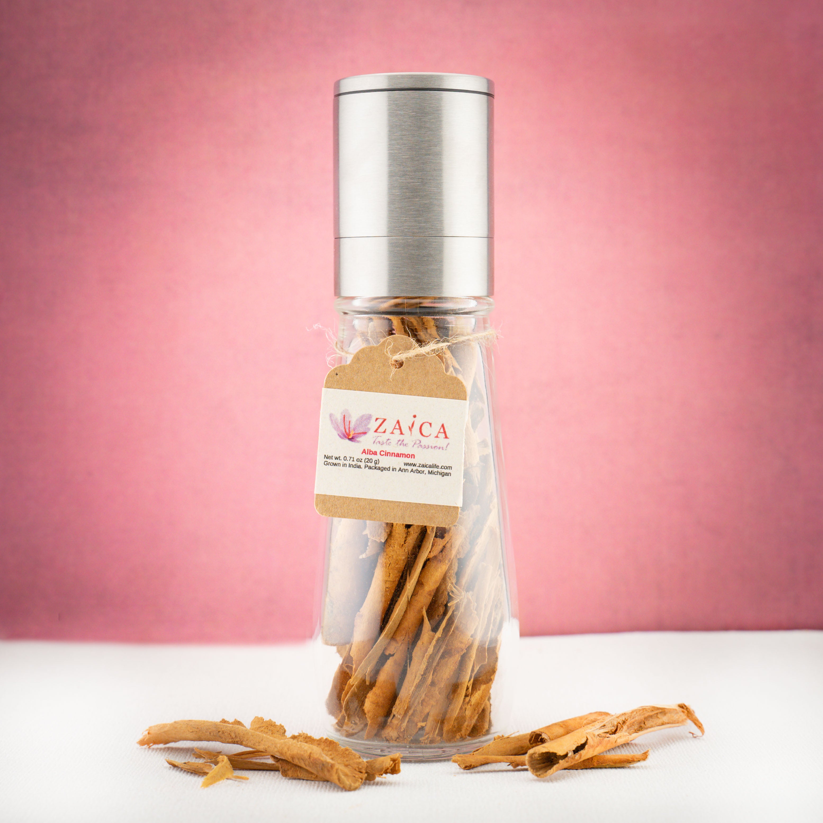 Alba cinnamon bark in stainless steel grinder for warm, aromatic flavor