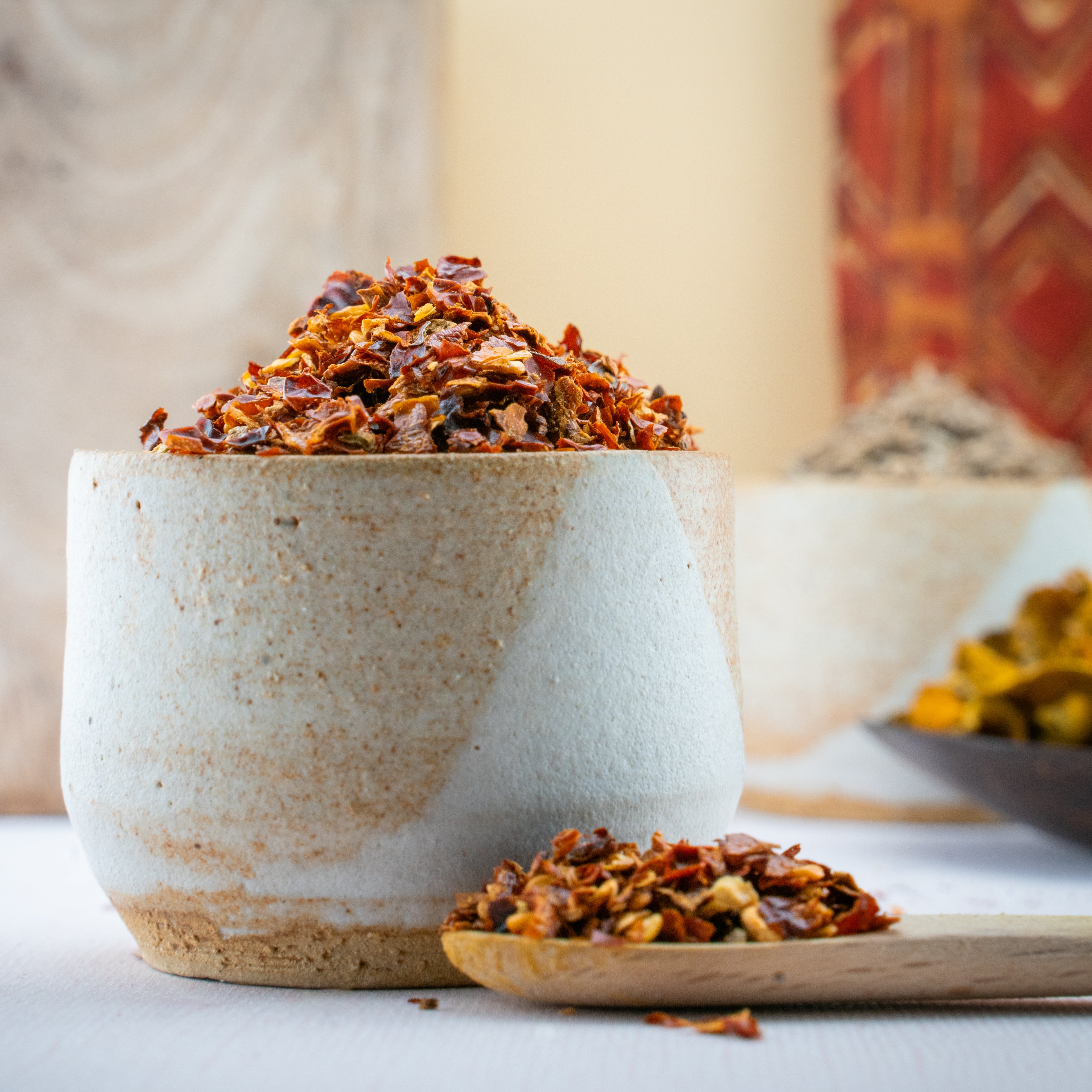 Fiery dalle pepper flakes with vibrant red color in clear spice jar